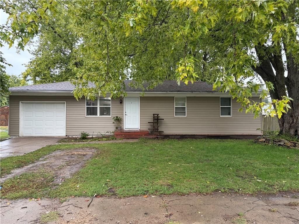 Mature trees and attached garage at 415 Main Street, Linwood, KS 66052