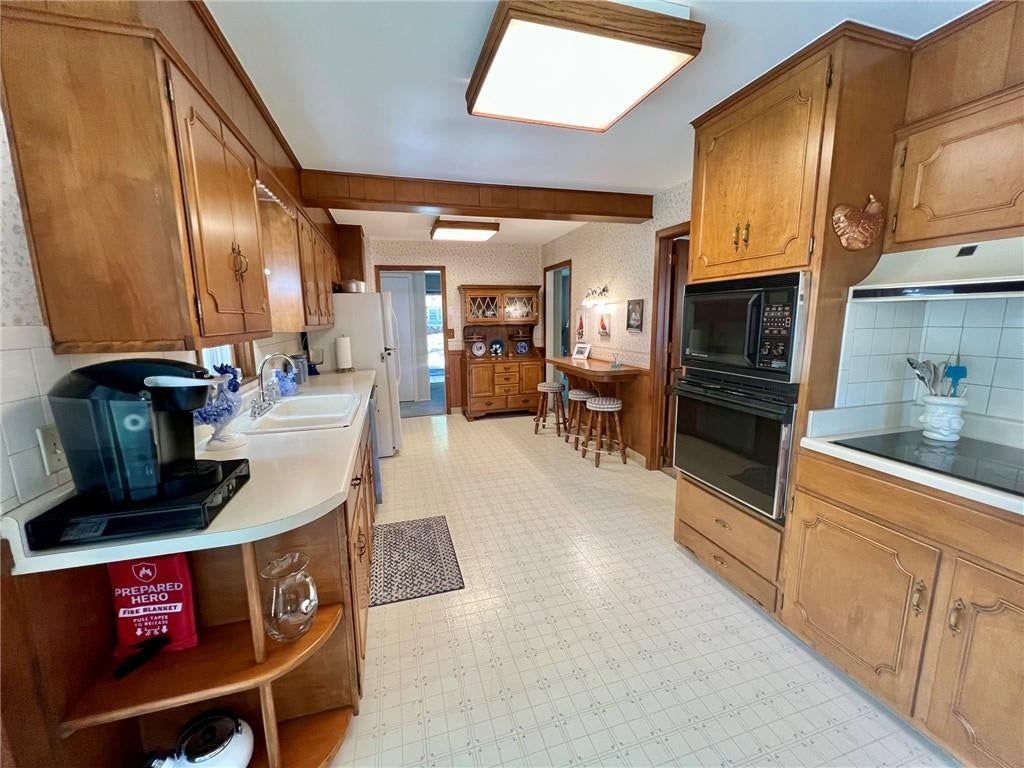 Wood kitchen cabinets at 3913 S Spring Street, Independence, MO 64055