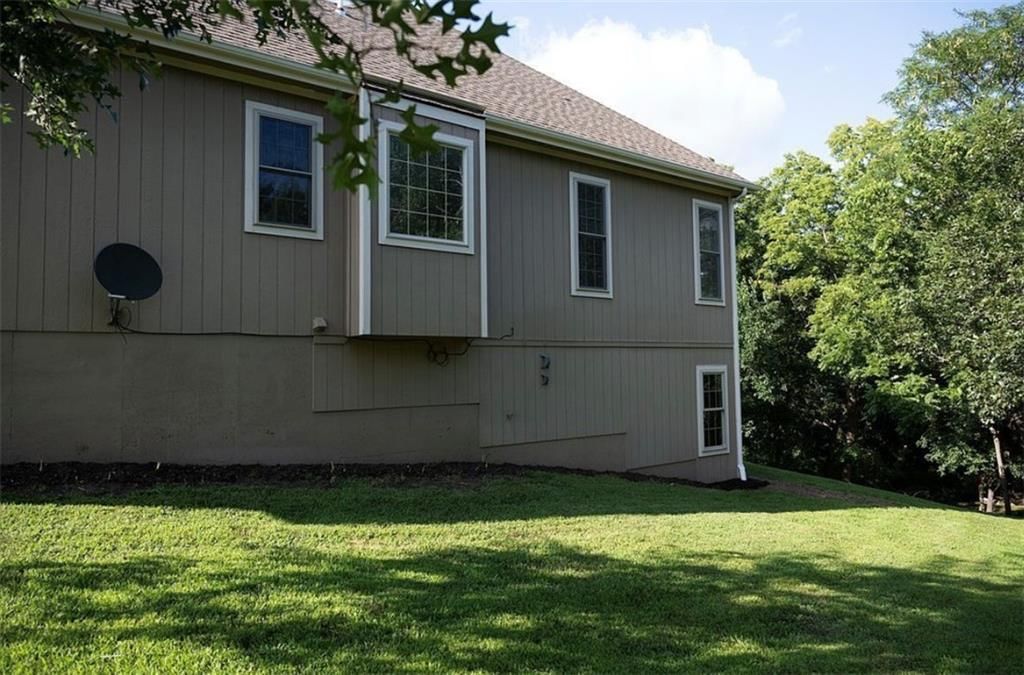 Big backyard and mature trees at 907 Order No. 11, Freeman, MO 64746