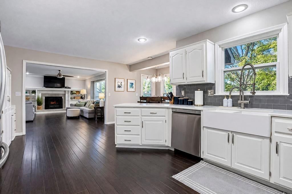White kitchen, updated kitchen and raised-panel cabinets at 16110 W 82nd Place, Lenexa, KS 66219