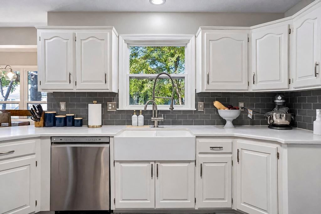 Kitchen backsplash, subway tile backsplash and white countertops at 16110 W 82nd Place, Lenexa, KS 66219