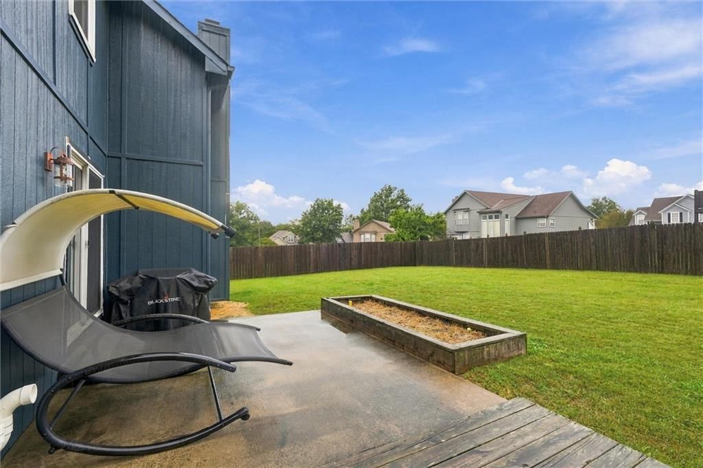 Photo 28: fenced yard, 1516 Wrangler Way, Raymore, MO 64083