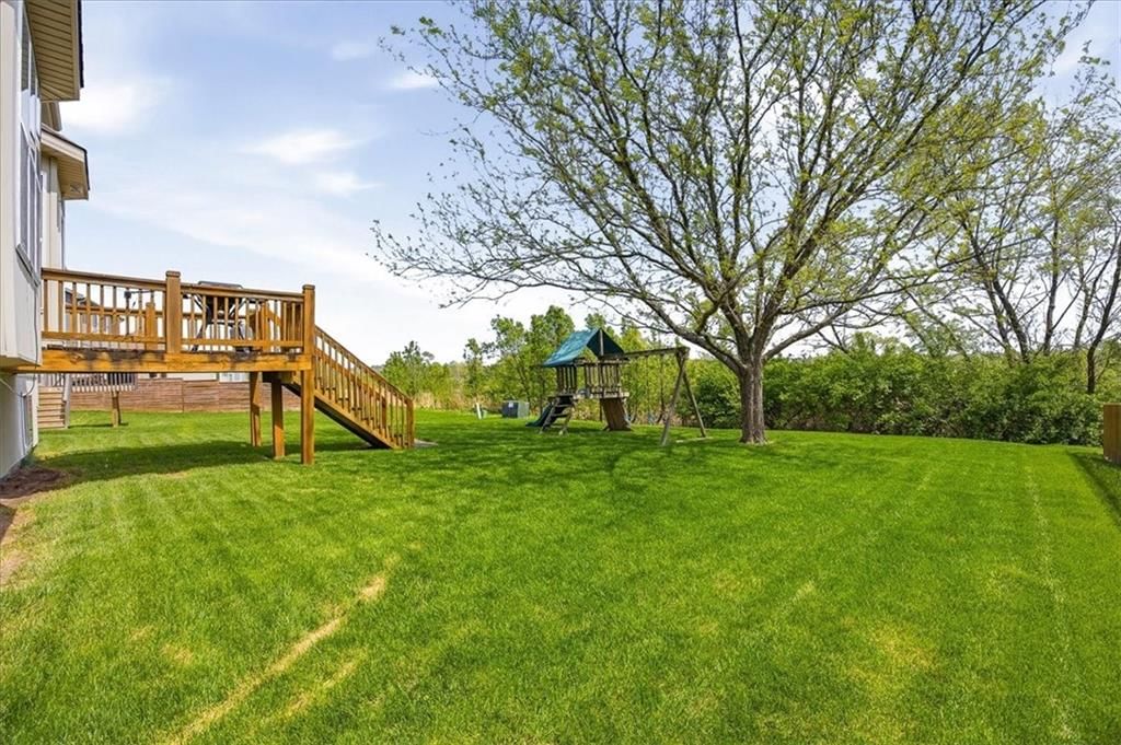Deck, big backyard and mature trees at 20117 E 24th Terr Court S, Independence, MO 64057