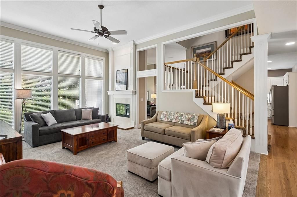 Hardwood floors, staircase and wood stair railing at 20405 W 98th Court, Lenexa, KS 66220