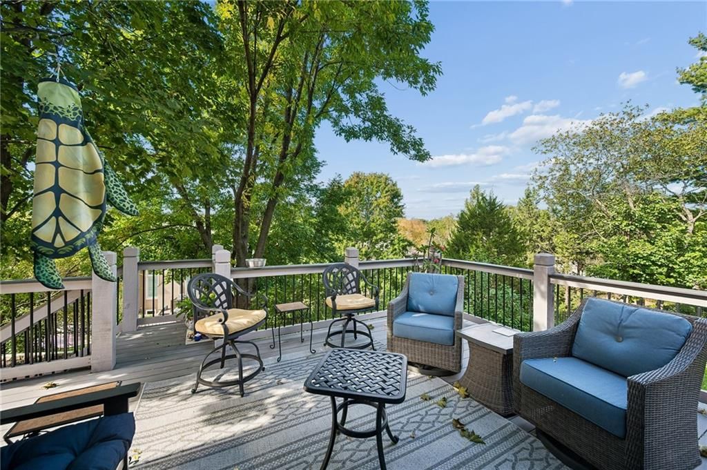 Deck, mature trees and wood deck at 20405 W 98th Court, Lenexa, KS 66220