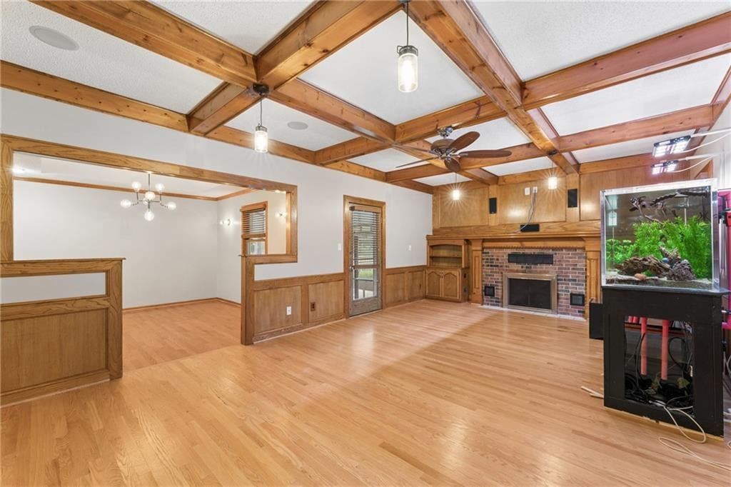 Open floor plan, wainscoting or board and batten and coffered ceiling at 617 W Maple Street, Raymore, MO 64083