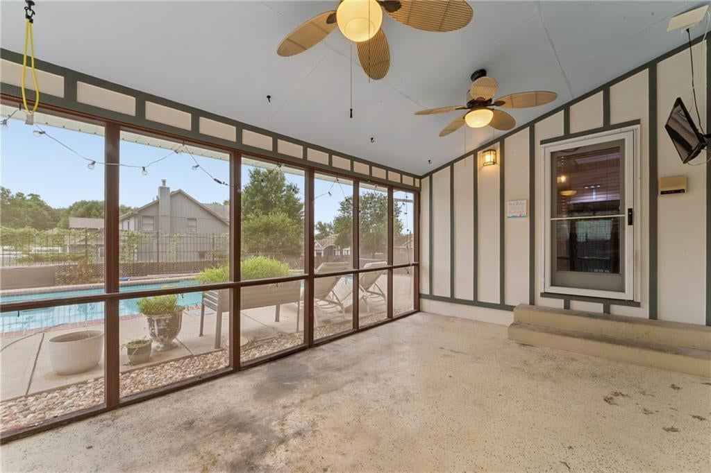 Screened porch, covered patio and concrete patio at 617 W Maple Street, Raymore, MO 64083
