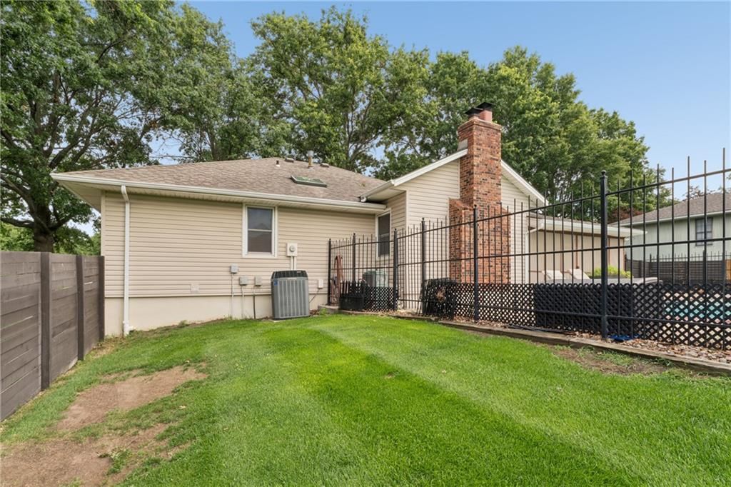 Big backyard and flat lot at 617 W Maple Street, Raymore, MO 64083