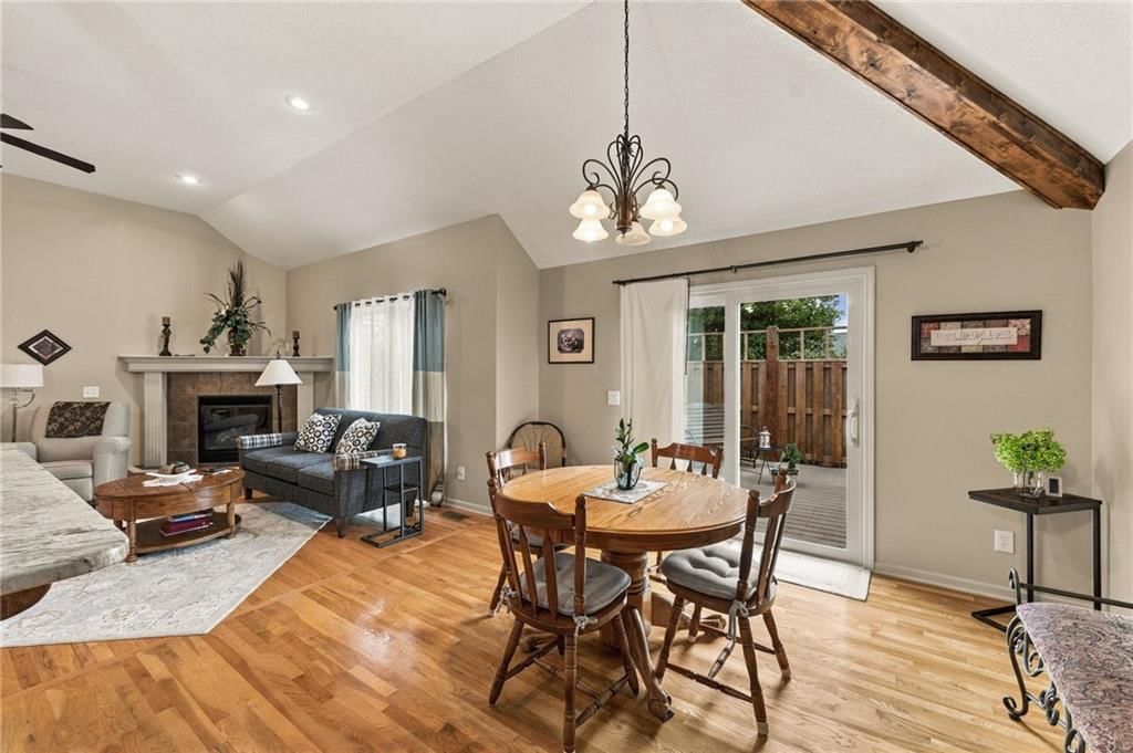 Statement lighting, ceiling beams and breakfast nook at 343 SE WOOD Lane, Lee's Summit, MO 64063