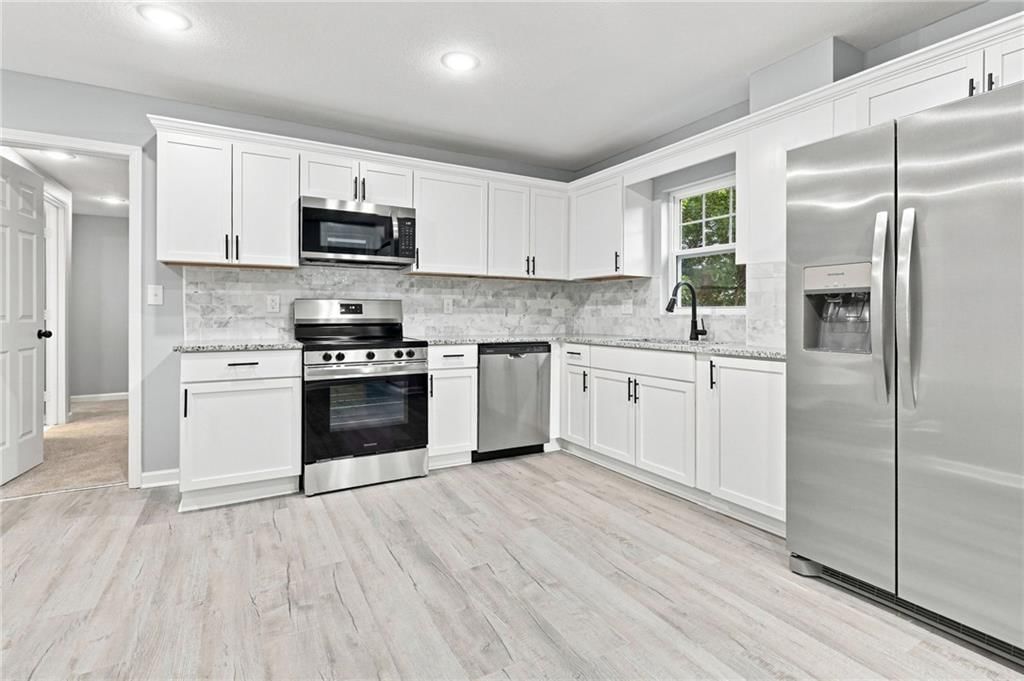 Photo 9: stainless steel appliances, 2421 N 72ND Street, Kansas City, KS 66109