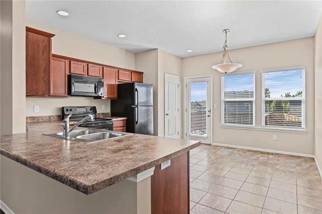 Open floor plan, breakfast nook and recessed lighting at 26169 W 141st Terrace, Olathe, KS 66061