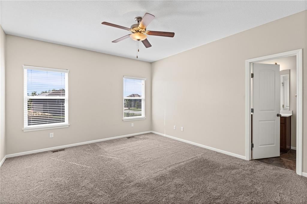 Main-floor primary bedroom at 26169 W 141st Terrace, Olathe, KS 66061
