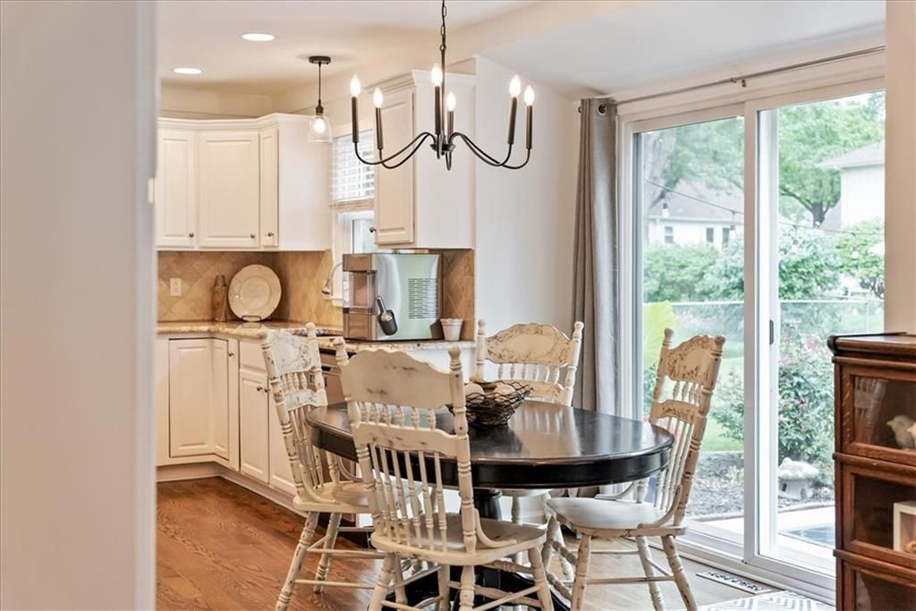 Open floor plan, statement lighting and breakfast nook at 10417 OAKMONT Street, Overland Park, KS 66215