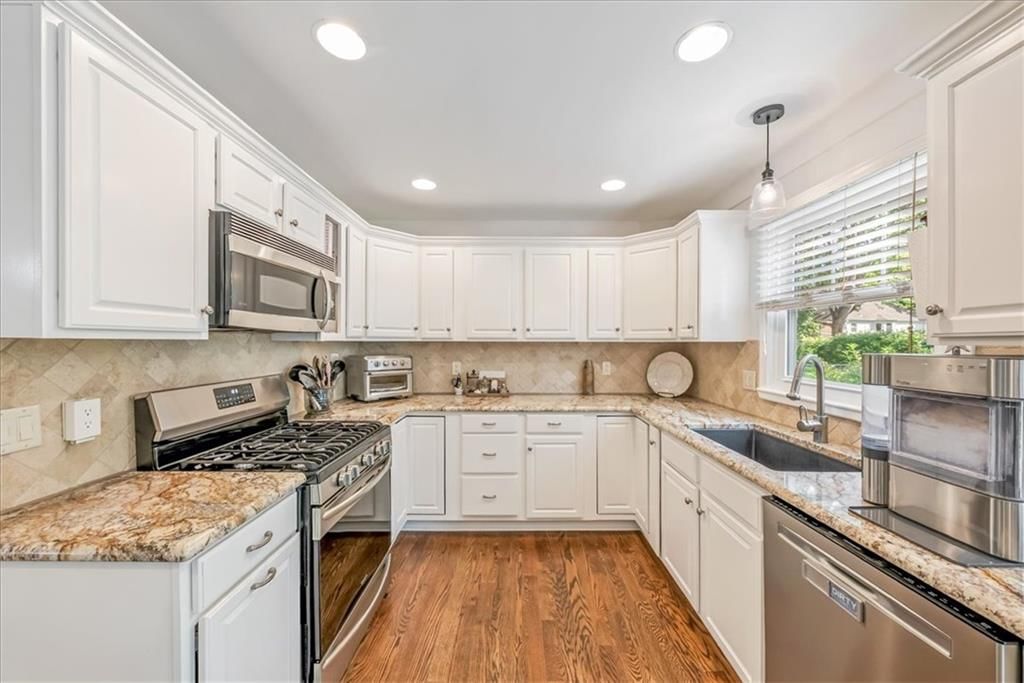 White kitchen at 10417 OAKMONT Street, Overland Park, KS 66215