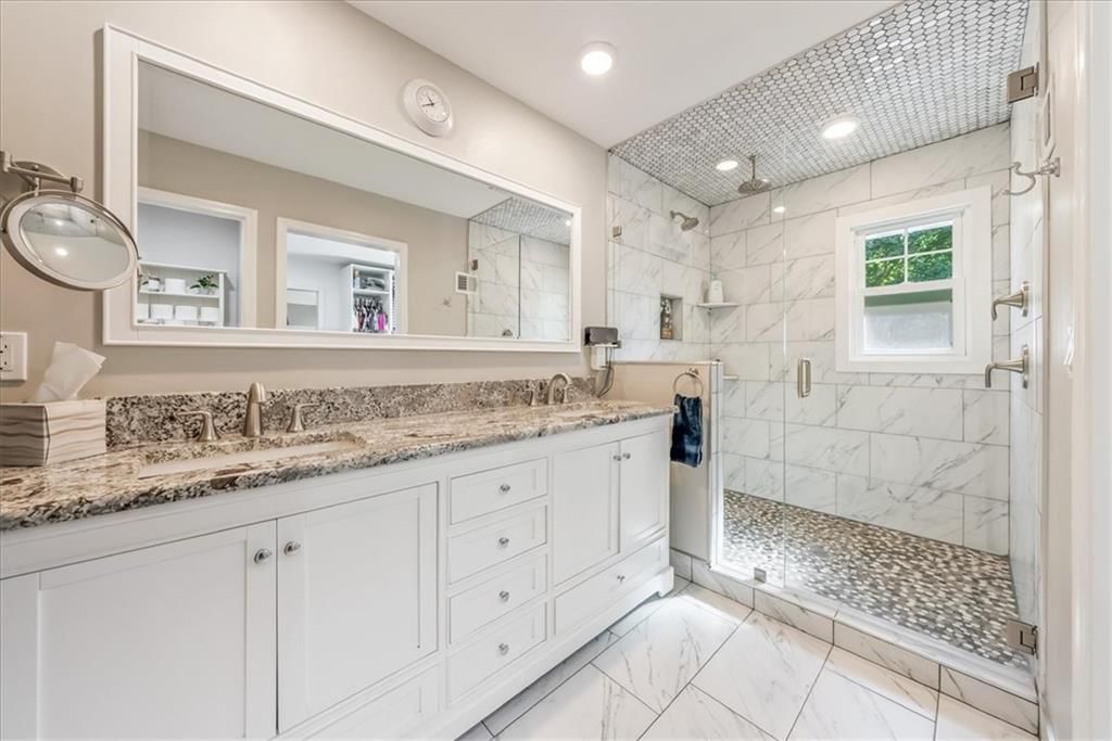 Walk-in shower, tiled shower and double vanity at 10417 OAKMONT Street, Overland Park, KS 66215