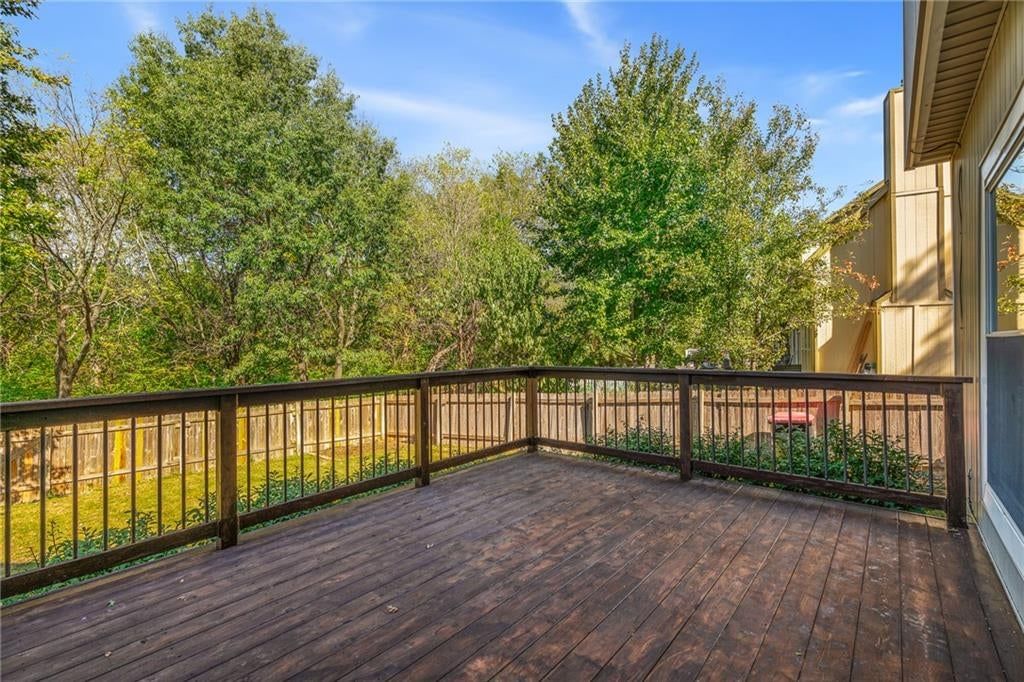 Deck, big backyard and fenced yard at 7702 W 155th Street, Overland Park, KS 66223