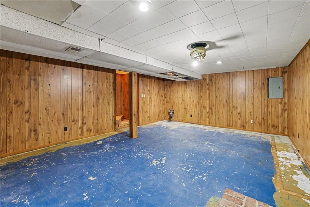 Finished basement, recessed lighting and staircase at 13935 S Cottonwood Drive, Olathe, KS 66062