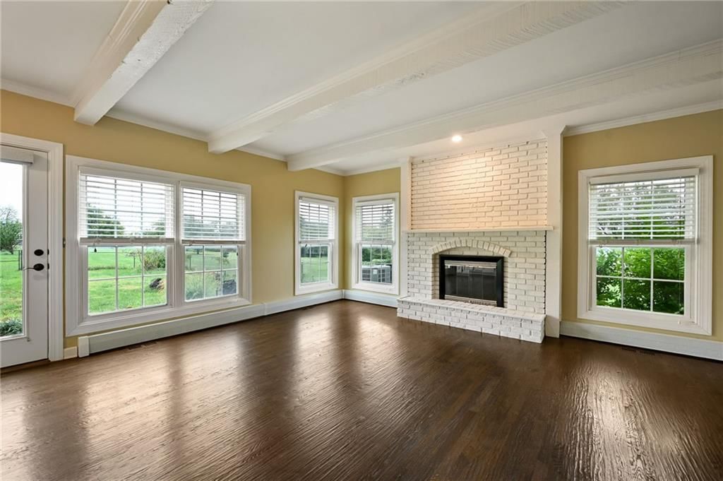 Fireplace, ceiling beams and brick fireplace at 3955 W 214th Street, Bucyrus, KS 66013