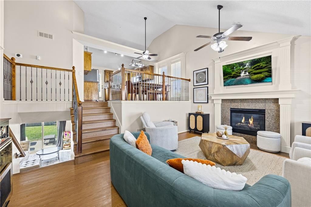 Tall ceilings, fireplace and open floor plan at 1113 Creekside Court, Raymore, MO 64083