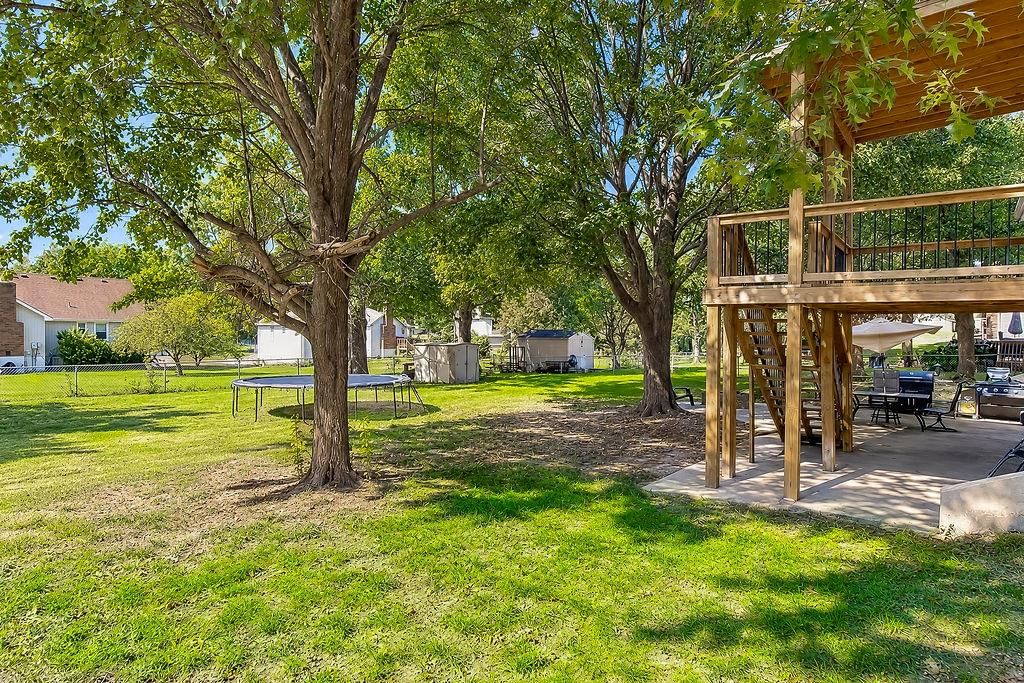Fenced yard at 704 Lark Street, Raymore, MO 64083