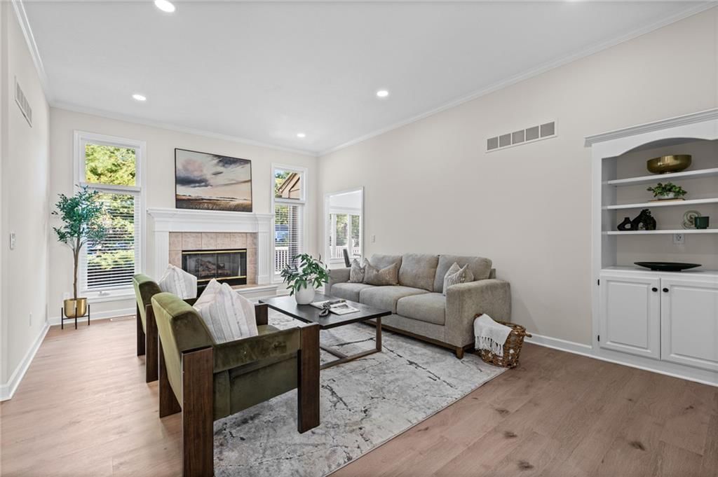 Fireplace, open floor plan and recessed lighting at 510 NW Ashurst Place, Lee's Summit, MO 64081