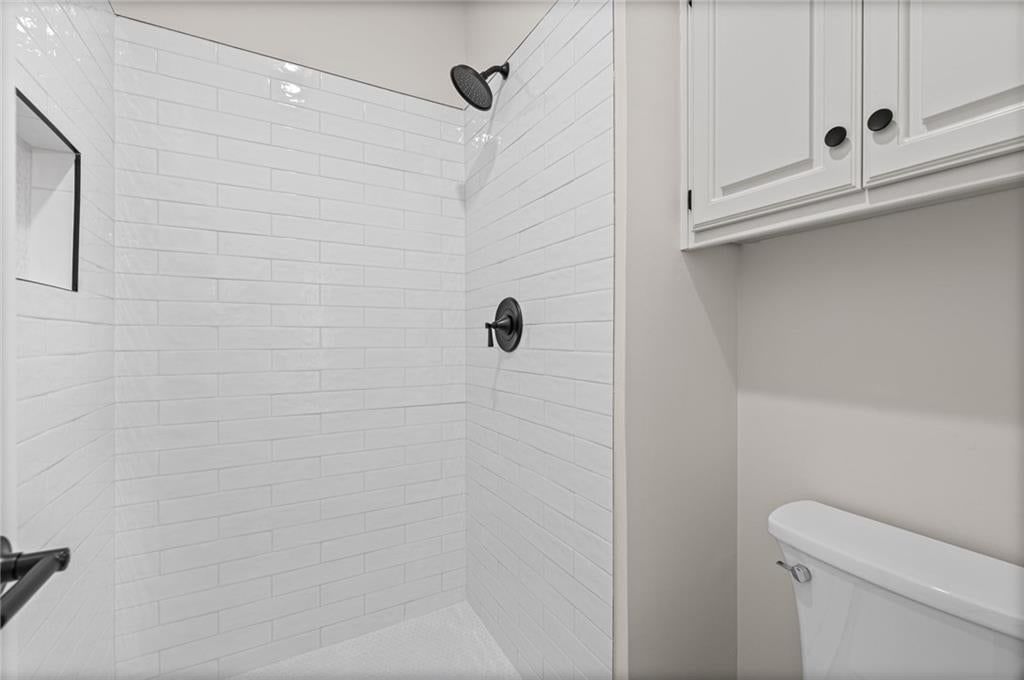 Walk-in shower and tiled shower at 510 NW Ashurst Place, Lee's Summit, MO 64081