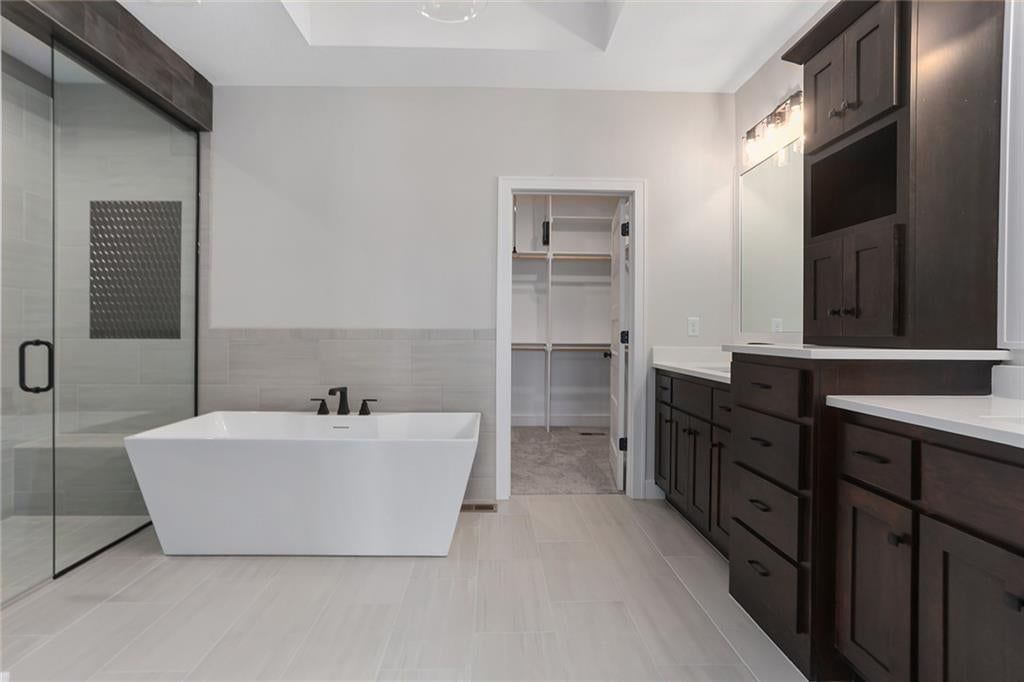 Walk-in shower, freestanding tub and tiled shower at 15041 W 130th Street, Olathe, KS 66062