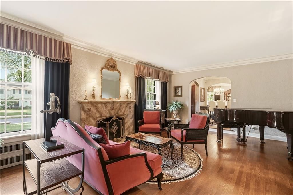 Fireplace, statement lighting and wainscoting or board and batten at 1010 W 65th Street, Kansas City, MO 64113