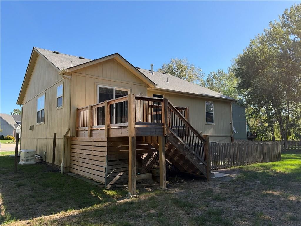 Deck and fenced yard at Birchwood Court, Raymore, MO 64083