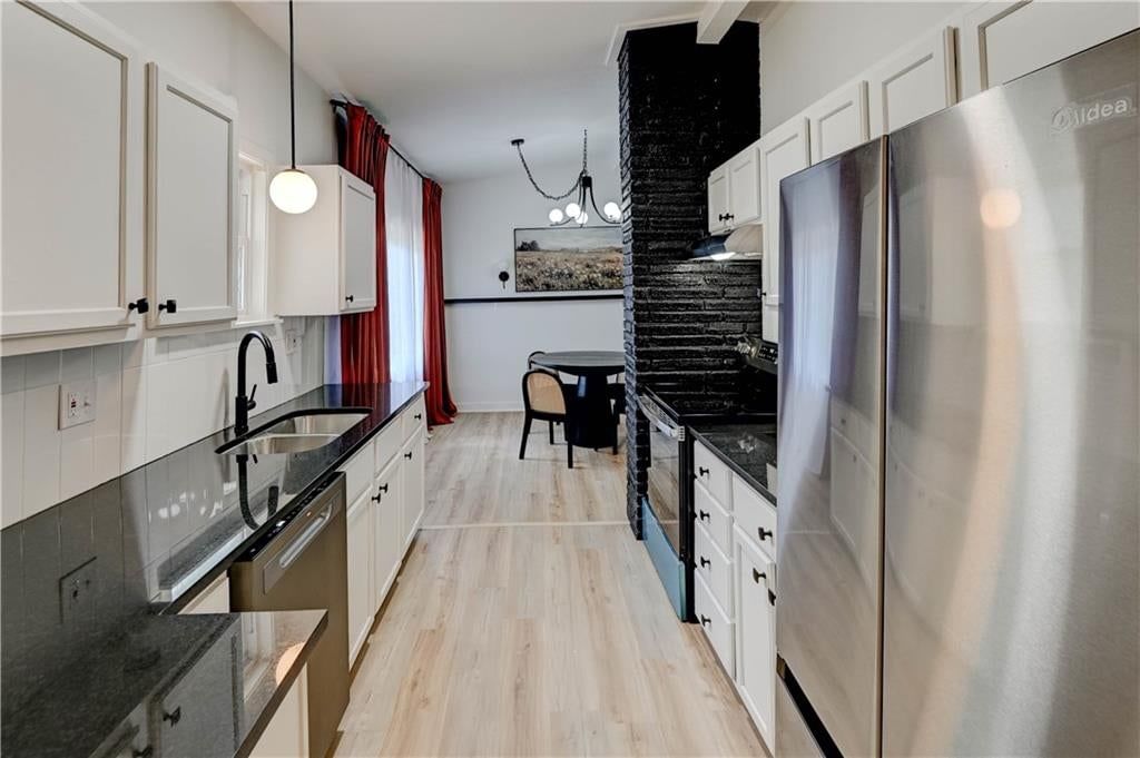 Open floor plan and breakfast nook at 9800 Parkwood Avenue, Kansas City, MO 64137