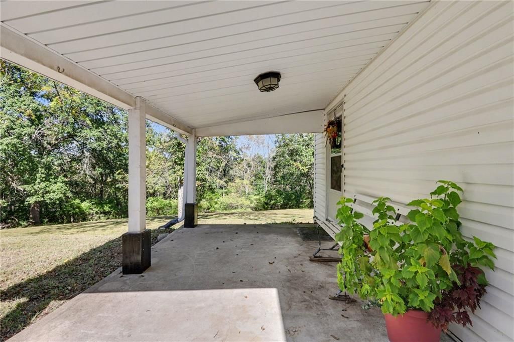 Covered front porch and covered patio at 11905 Little Blue Road, Kansas City, MO 64133