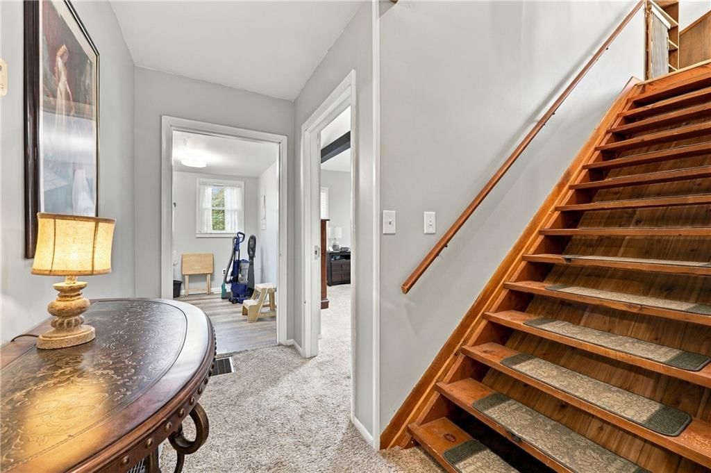 Staircase and wood stair railing at 1009 E 134th Street, Grandview, MO 64030