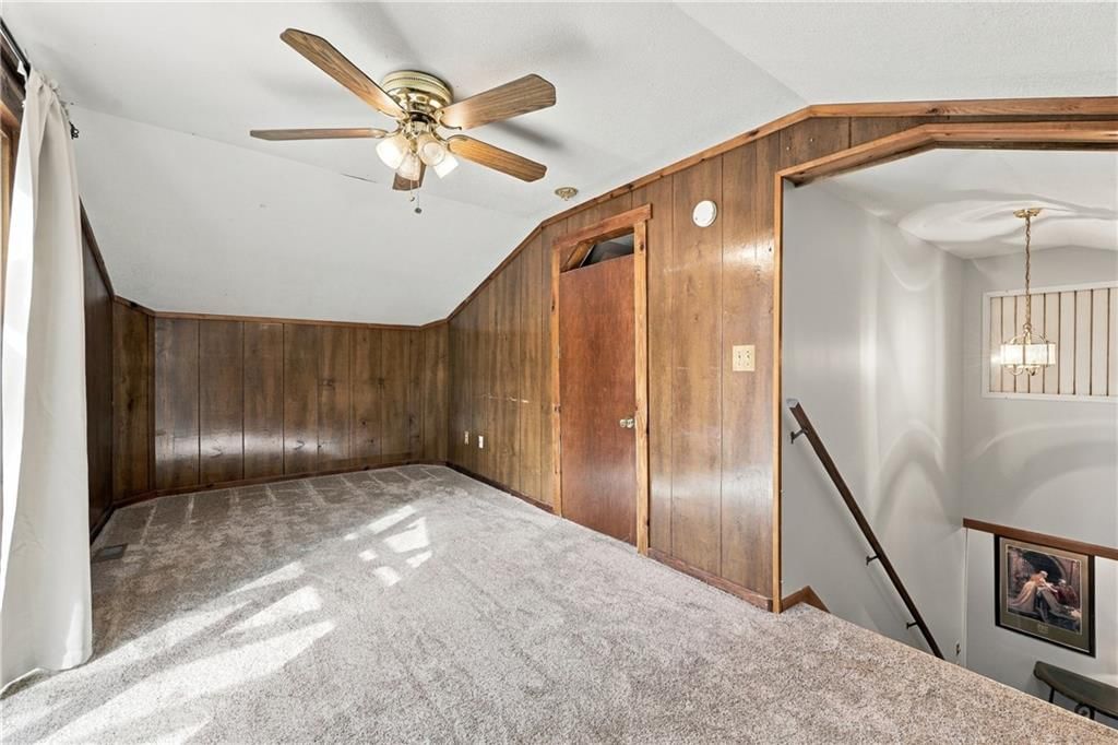 Shiplap / paneling and bonus room at 1009 E 134th Street, Grandview, MO 64030