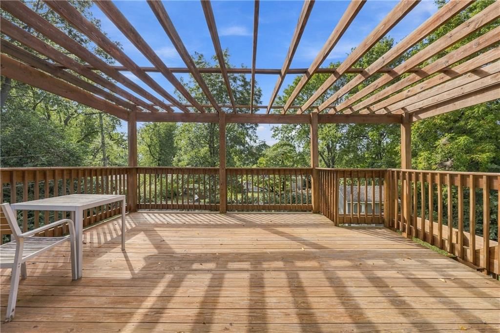 Deck, big backyard and pergola at 1009 E 134th Street, Grandview, MO 64030