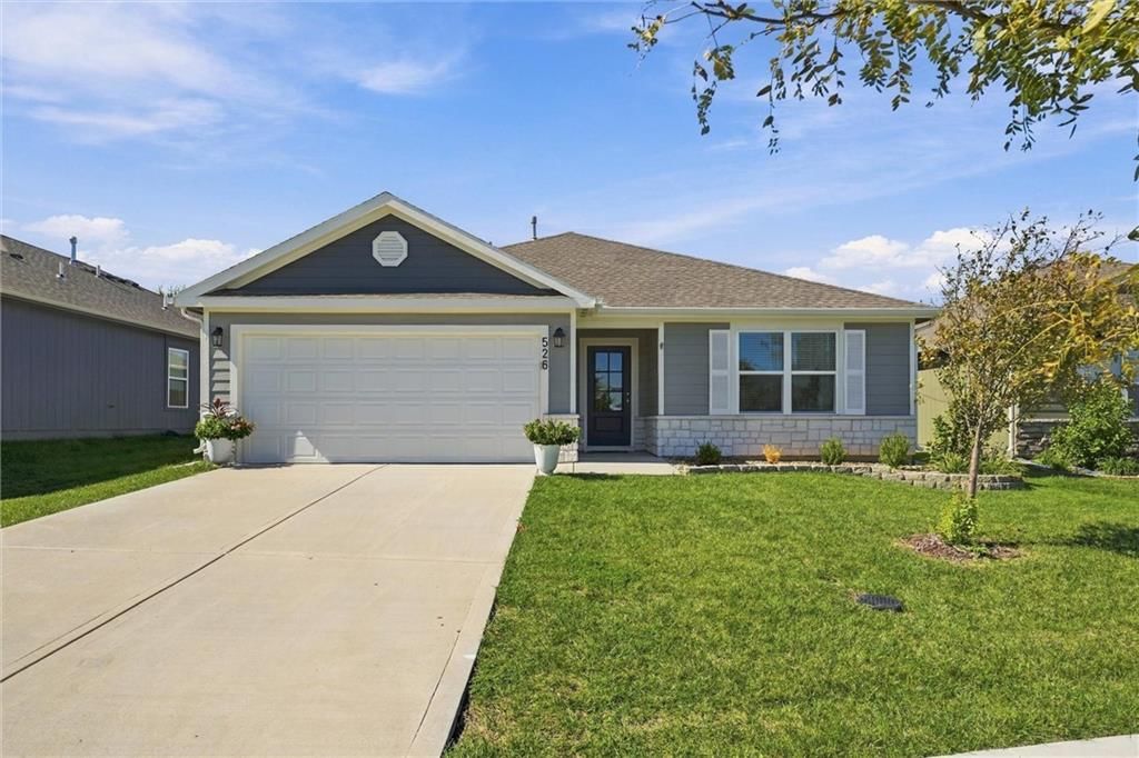 Covered front porch and attached garage at 526 N Pear Street, Gardner, KS 66030