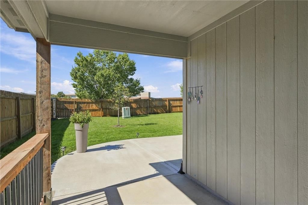 Fenced yard and covered patio at 526 N Pear Street, Gardner, KS 66030