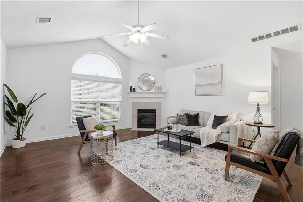 Tall ceilings, fireplace and hardwood floors at 6122 NE KENSINGTON Drive, Lee's Summit, MO 64064