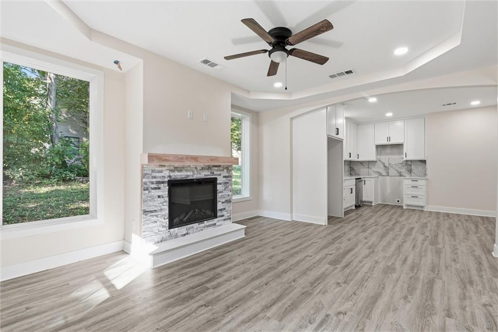 Fireplace, open floor plan and tray ceiling at 614 Spruce Street, Leavenworth, KS 66048