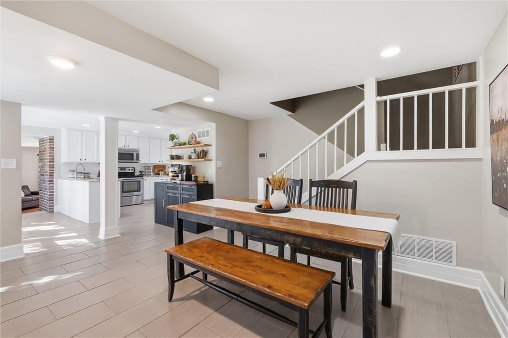 Tile floors, staircase and mixed stair railing at 14340 S Gardner Road, Gardner, KS 66030
