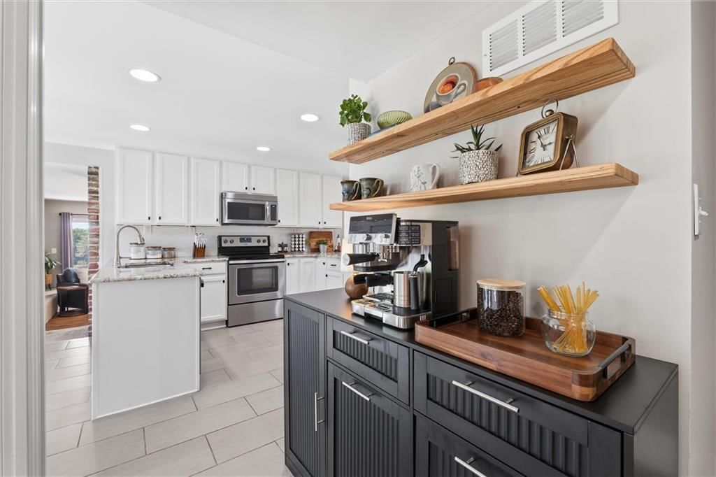 White kitchen, stainless steel appliances and updated kitchen at 14340 S Gardner Road, Gardner, KS 66030