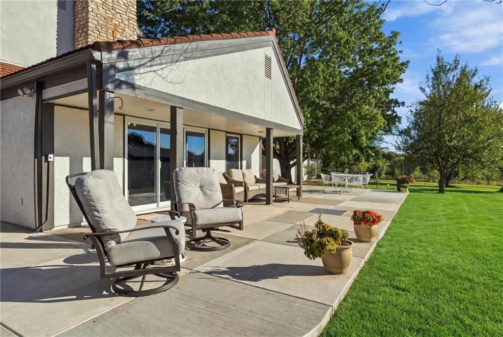 Covered patio and concrete patio at 14340 S Gardner Road, Gardner, KS 66030