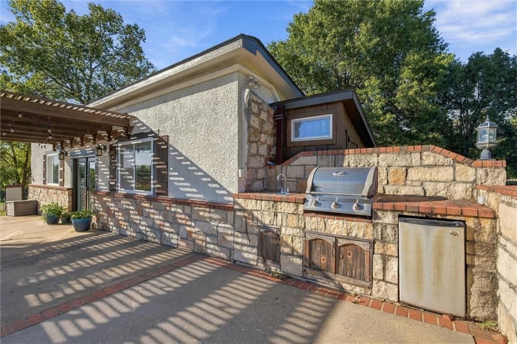 Pergola and outdoor kitchen at 14340 S Gardner Road, Gardner, KS 66030