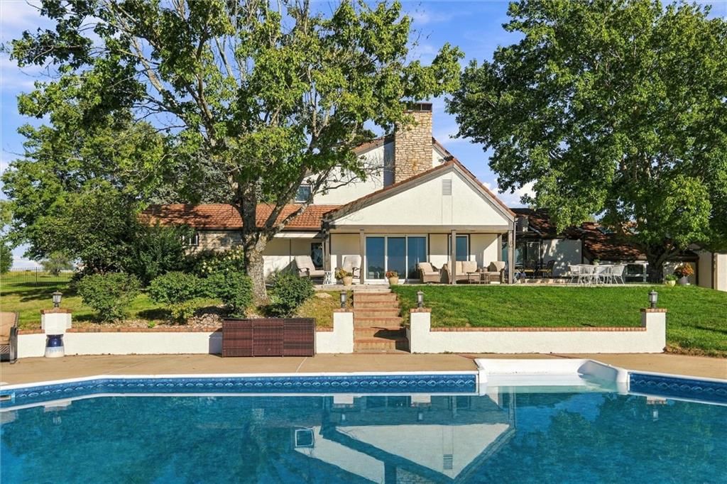 Big backyard, mature trees and in-ground pool at 14340 S Gardner Road, Gardner, KS 66030