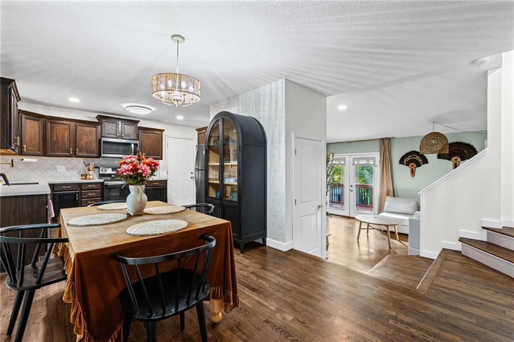 Open floor plan, staircase and wood stair railing at 7711 NE 53rd Terrace, Kansas City, MO 64119