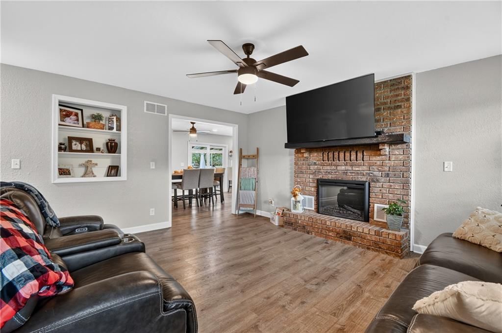 Fireplace, exposed brick wall and brick fireplace at 18902 E 263rd Street, Harrisonville, MO 64701