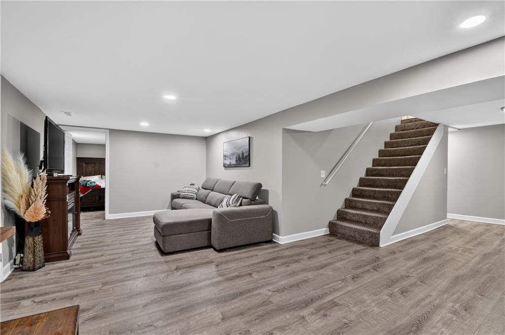 Finished basement, staircase and wood stair railing at 18902 E 263rd Street, Harrisonville, MO 64701