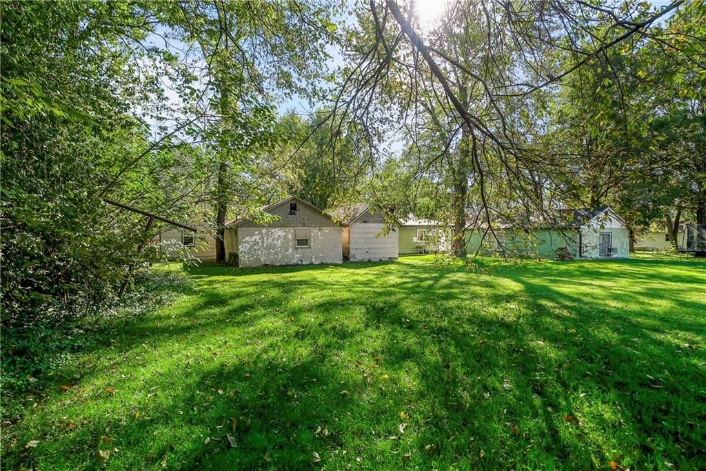 Big backyard, mature trees and flat lot at 412 14th Street, Osawatomie, KS 66064