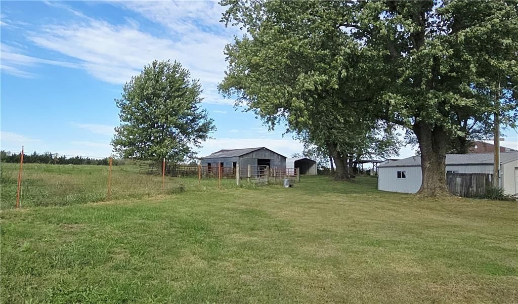 Big backyard, fenced yard and mature trees at 34306 Indianapolis Road, Osawatomie, KS 66064