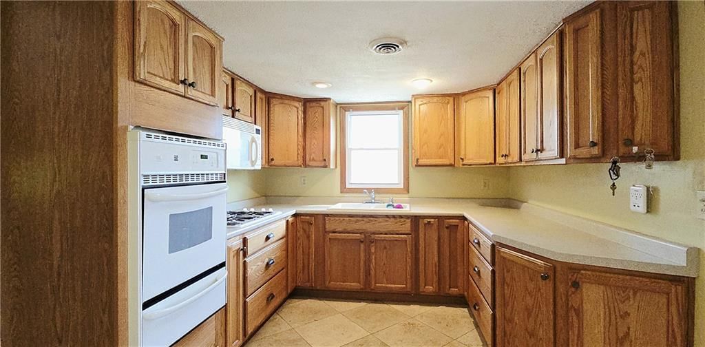 Tile floors and recessed lighting at 34306 Indianapolis Road, Osawatomie, KS 66064