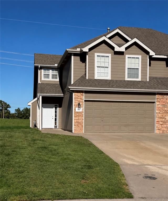 Covered front porch and attached garage at 911 169th Street, Basehor, KS 66007